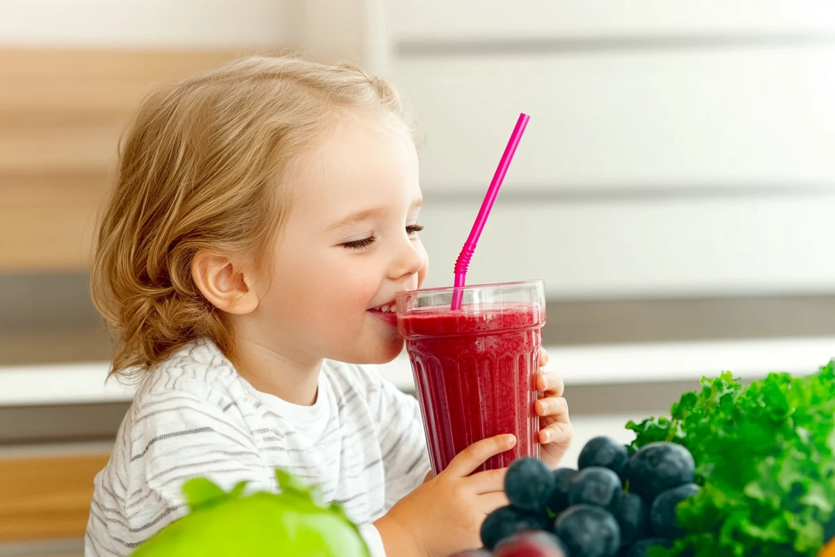 Kid enjoying smoothies for